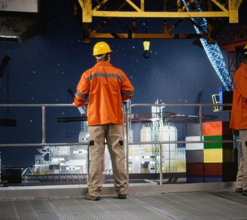 Worker hard hat conducts system inspections offshore drilling rig from industrial platform 360x320