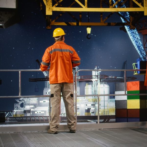 Worker hard hat conducts system inspections offshore drilling rig from industrial platform 600x600